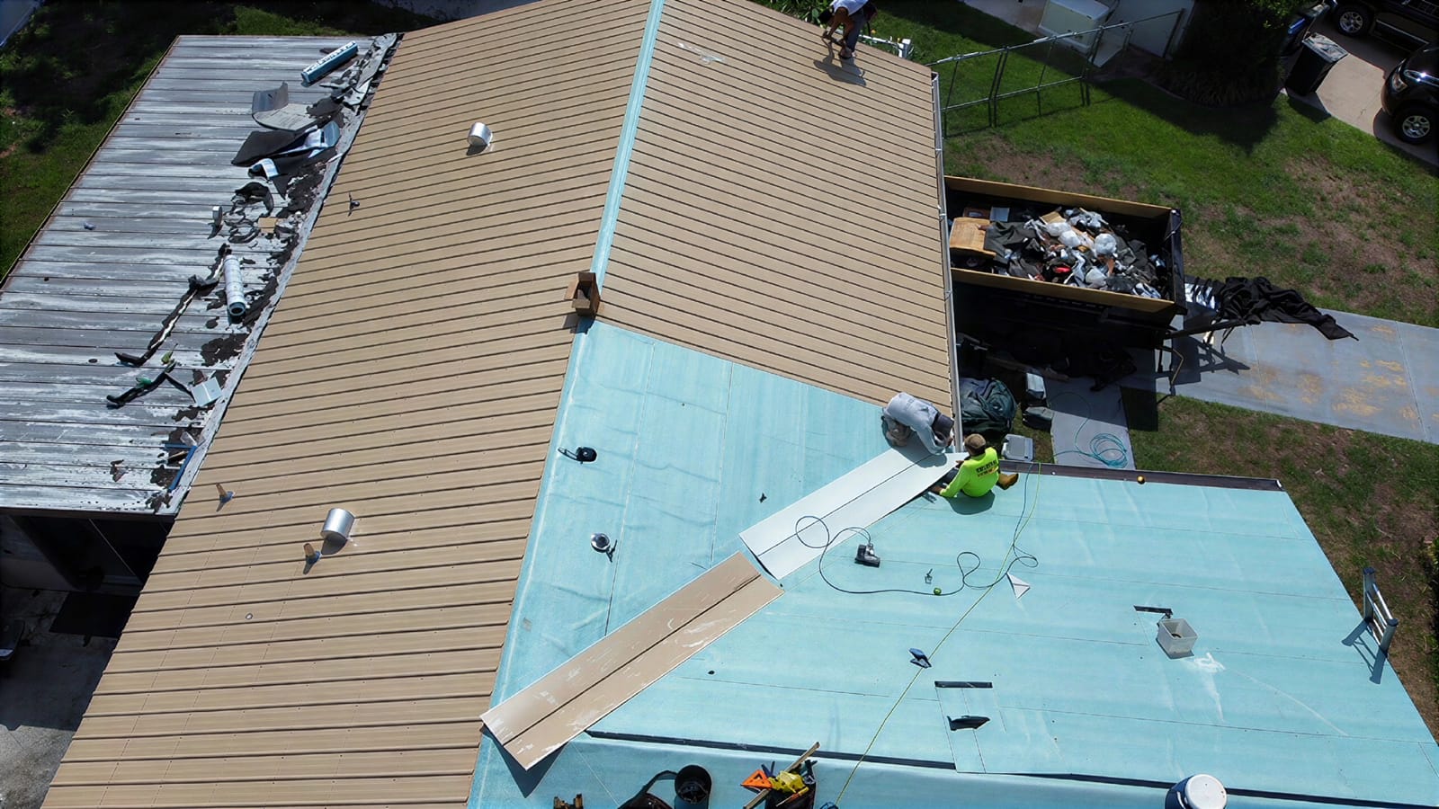 Integrity Roofing of Florida crew installing a new metal roof on a Tampa Bay home