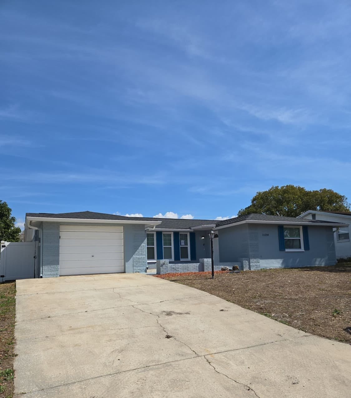 New architectural shingle roof on a Port Richey, FL home installed by Integrity Roofing of Florida
